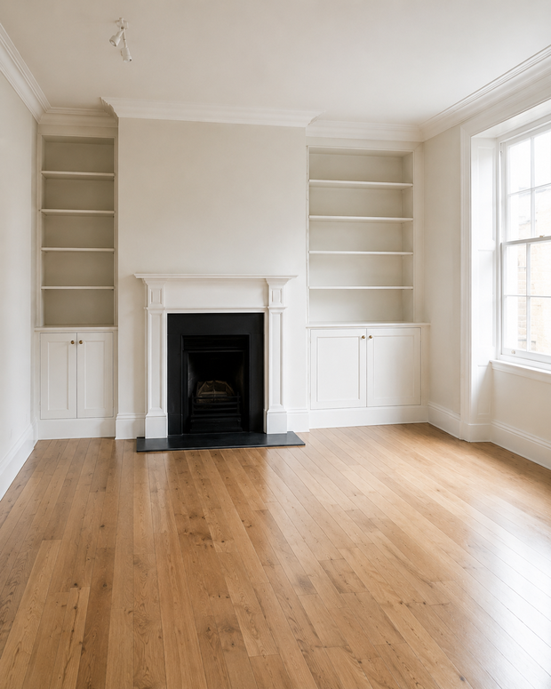 An emptied room with bare floors and shelving after a full property clearance